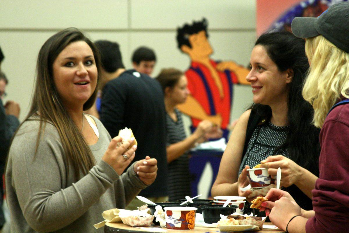 Students enjoy food at the Taste of Des Moines. LORIEN MACENULTY | STAFF WRITER