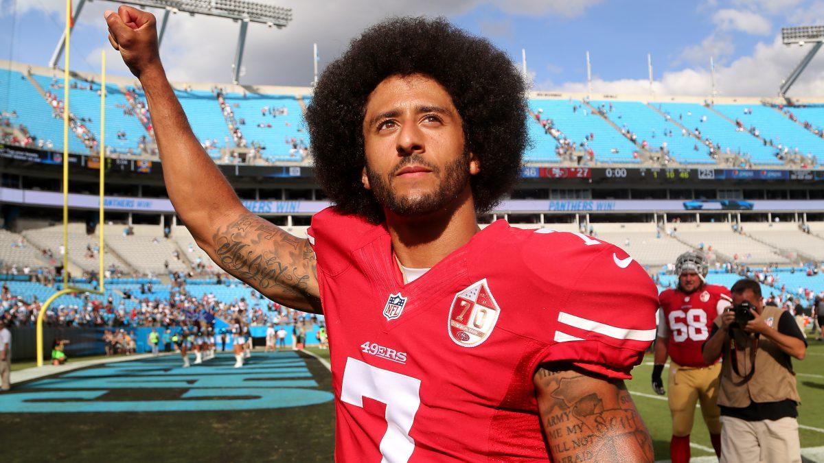 Charlotte, NC - September 18, 2016: San Francisco 49ers quarterback Colin Kaepernick (7) walks off the field at Bank of America Stadium with his fist up in the air after their game against the Panthers.(Gerry Melendez for ESPN)