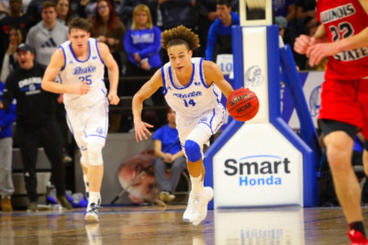 SOPHOMORE POINT GUARD Noah Thomas pushes the ball up the court against Illinois State University on Sunday. The Bulldogs fell to the Redbirds for the second time this season 60-67.