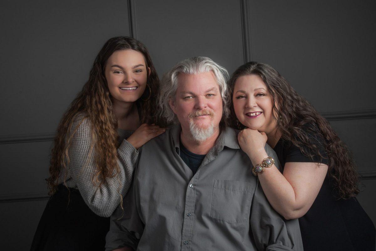 Cardwell with his wife (right) and daughter (left)