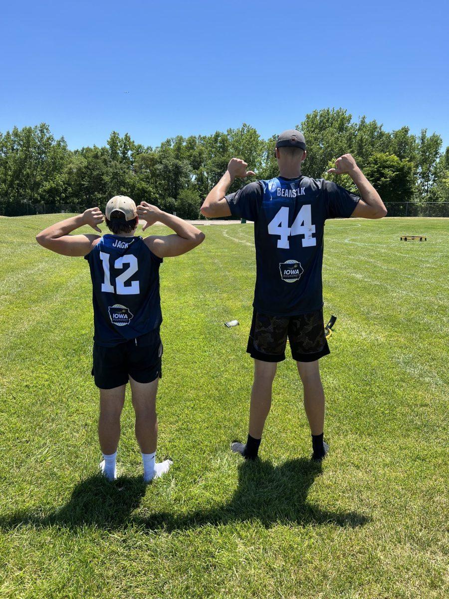 Spikeballers pointing at their jersey