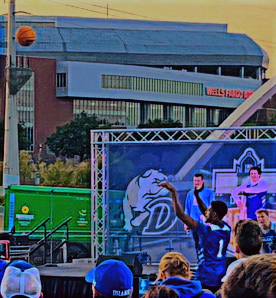 BASKETBALL PLAYERS engaged in a shooting contest at the event. PHOTO BY floyd ezell