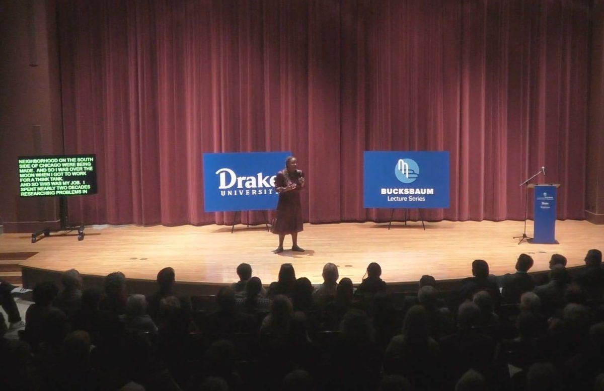  HEATHER MCGHEE spoke to the Bucksbaum Lecture in Business audience about ‘drained pool politics,’ where local governments remove public resources rather than let them integrate, resulting in heightened racial and class inequality. PHOTO BY Meghan Holloran | photo editor