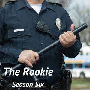 A cop holding a baton overlayed with the text "The Rookie, Season Six," in the bottom left corner of the photo.