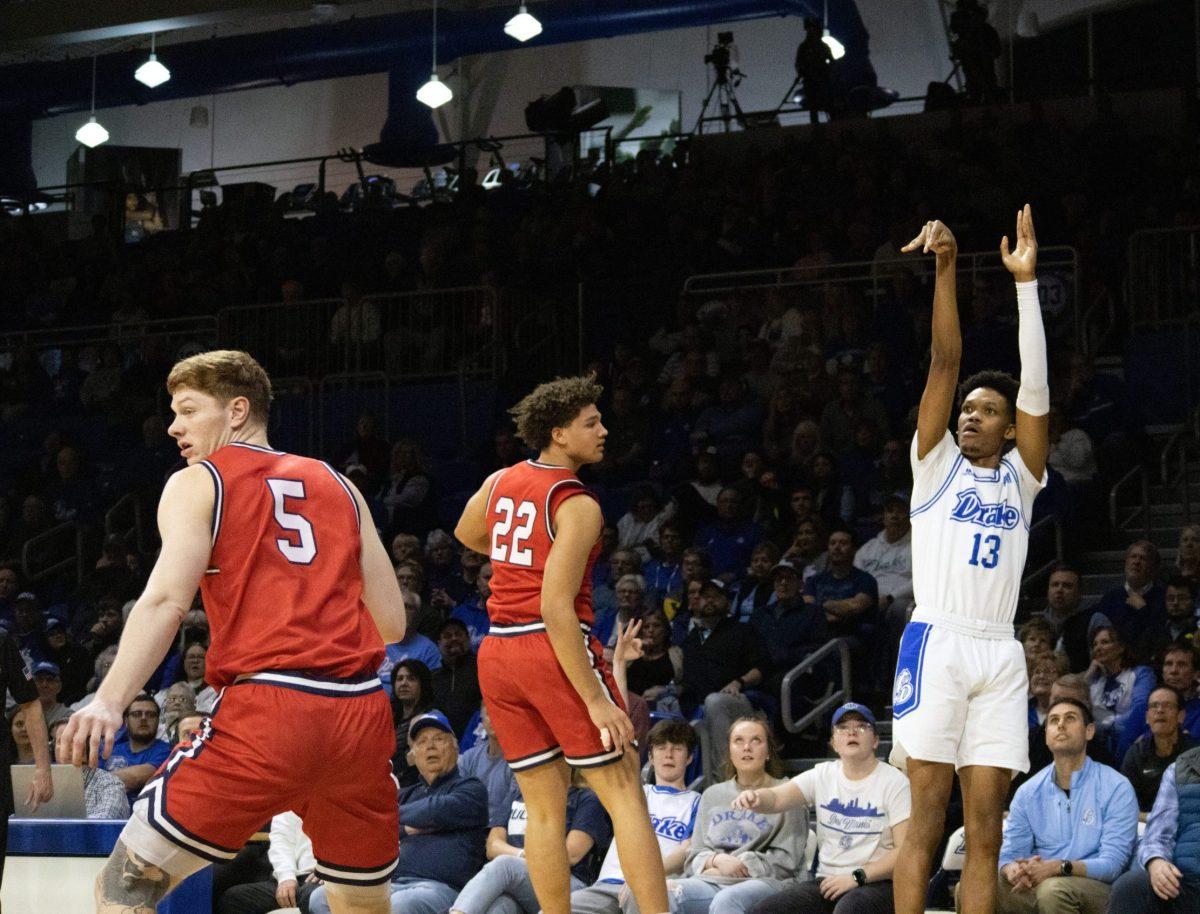 Drake men's basketball player shooting the ball towards the hoop.