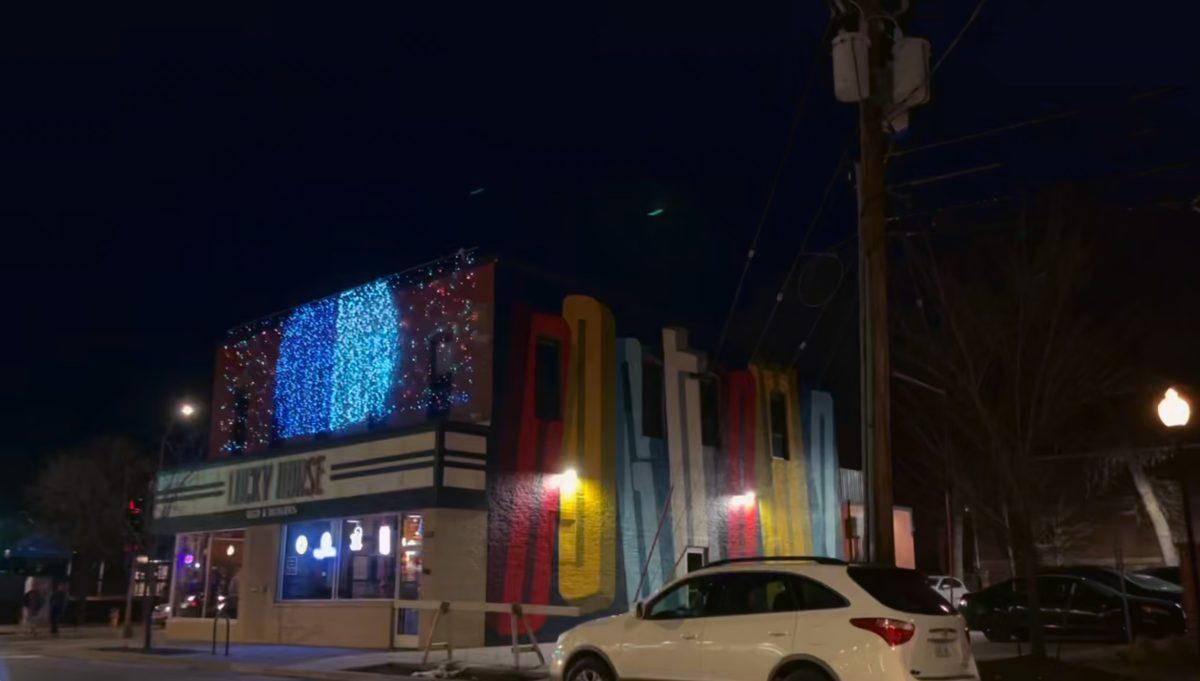 The Dogtown light show gave graphic design students opportunities to see their designs displayed on storefronts on University Avenue. Photo courtesy of Kathryn Dennigmann