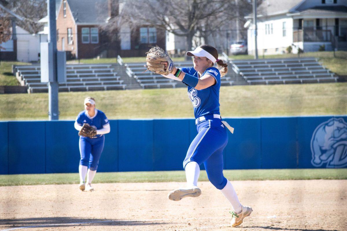 Drake Women's Softball pitcher pitches to a batter