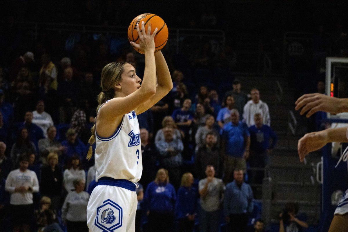 Drake Women's Basketball player looks for a pass