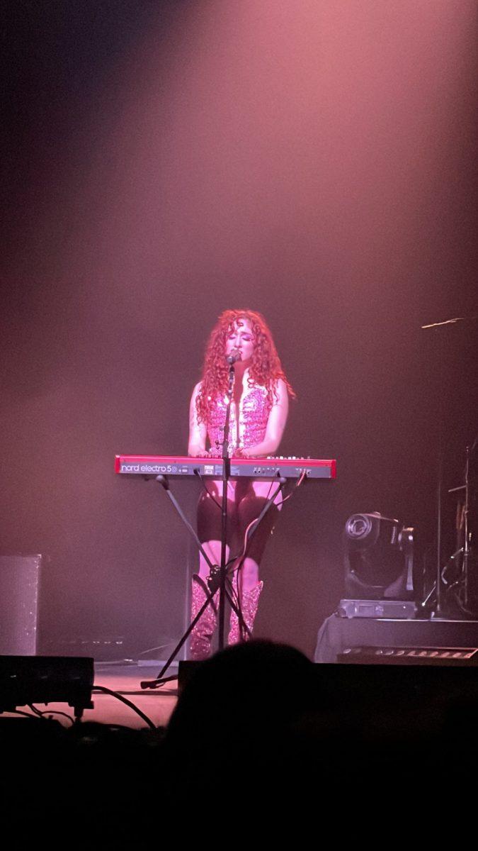 Singer Chappell Roan, stand over a piano and sings "Kaleidoscope."