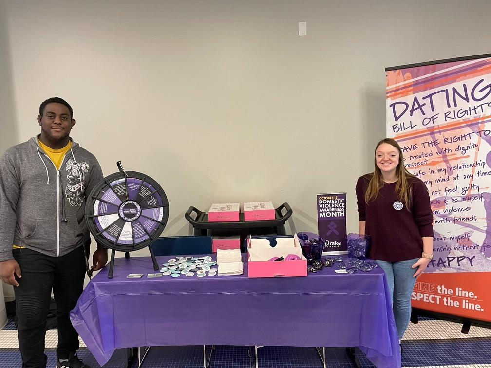 Student Violence Intervention Partners tabled in October about Domestic Violence Awareness Month, sharing information and doughnuts. Photo by Parker Wright | News Editor