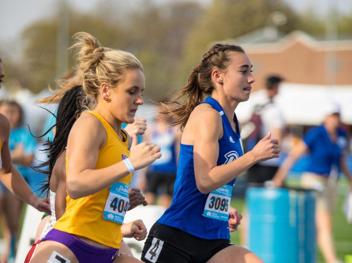 Drake runner Emilie Meyers running the Blue Oval