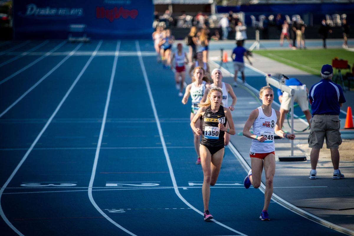 Megan Cunningham of the University of Missouri competes in the women's 10,000m race wearing racing buns, a short-cut uniform traditional for female athletes, during a 2018 track meet. Photo courtesy of Phil Roeder via Wikimedia.