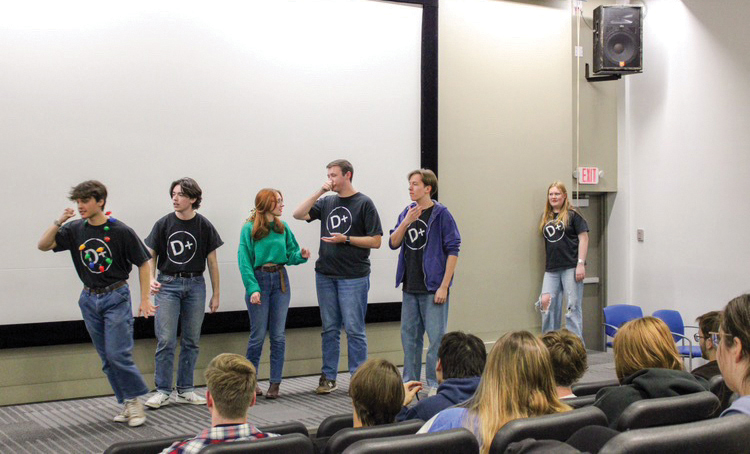 Members of D+ perform onstage for an audience at one of their live events. Keep up with the Troupe’s future events by following their Instagram page, @drakeimprov. Photo courtesy of D+.