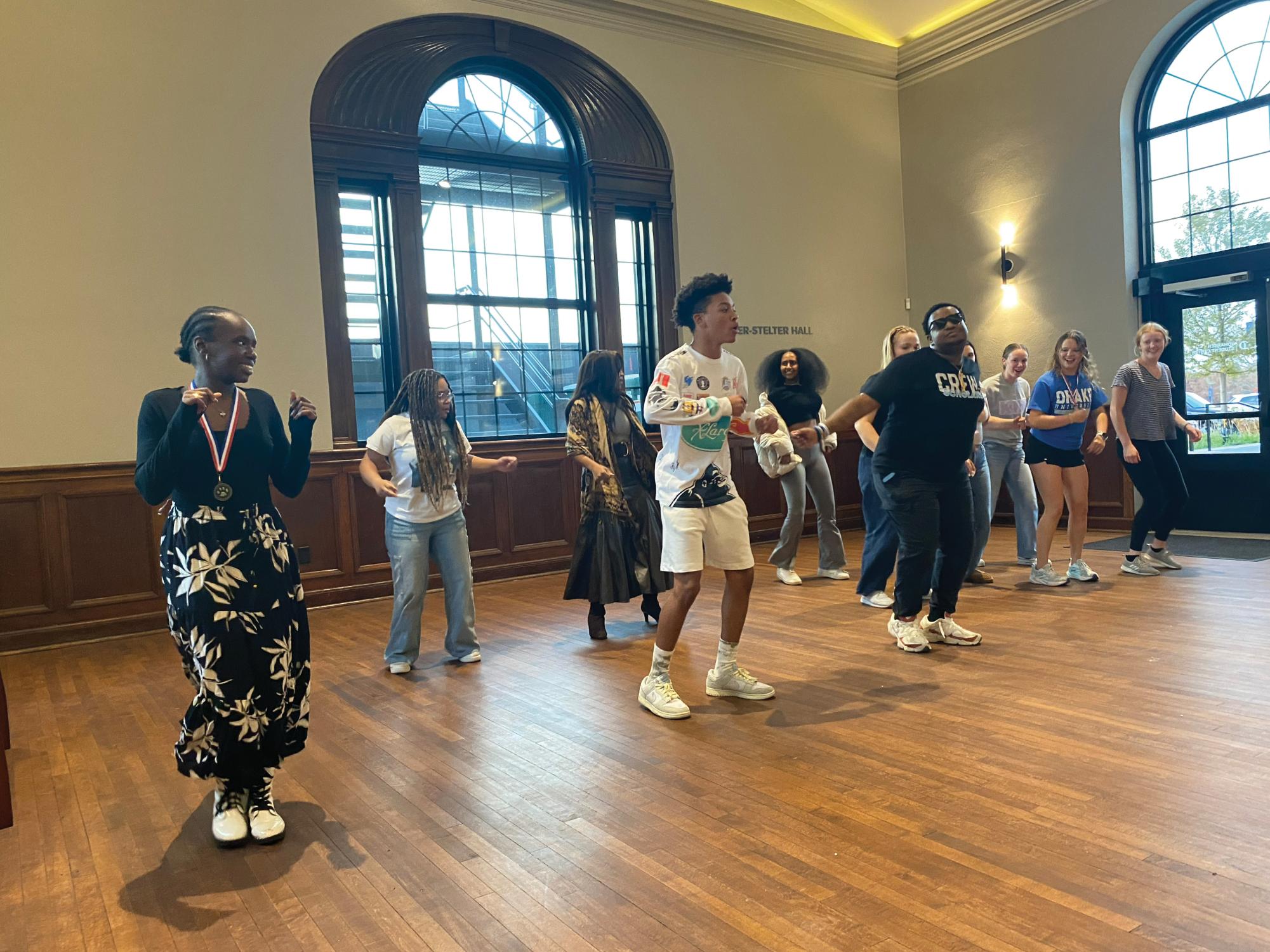 Students teach their peers line dances at the Belonging Festival in Fisher-Stelter Hall on Nov. 14. The festival closed Crew Scholars’ Bulldogs Belong Week, which was filled with events that celebrated connection, community and identity.