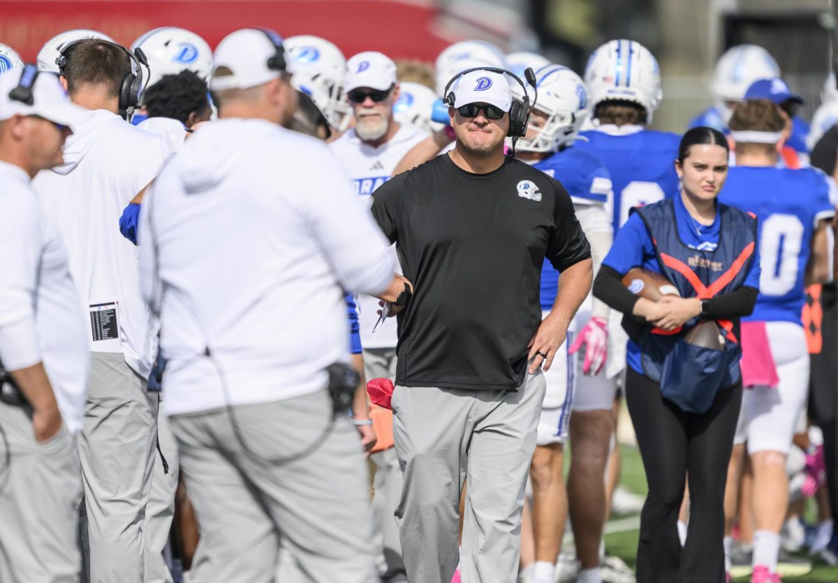 Former head football coach Joe Woodley observes a game on the sidelines. Woodley announced his resignation from the Bulldogs Feb. 9 and will join the coaching staff at Rutgers University. Photo courtesy of Drake University Athletics