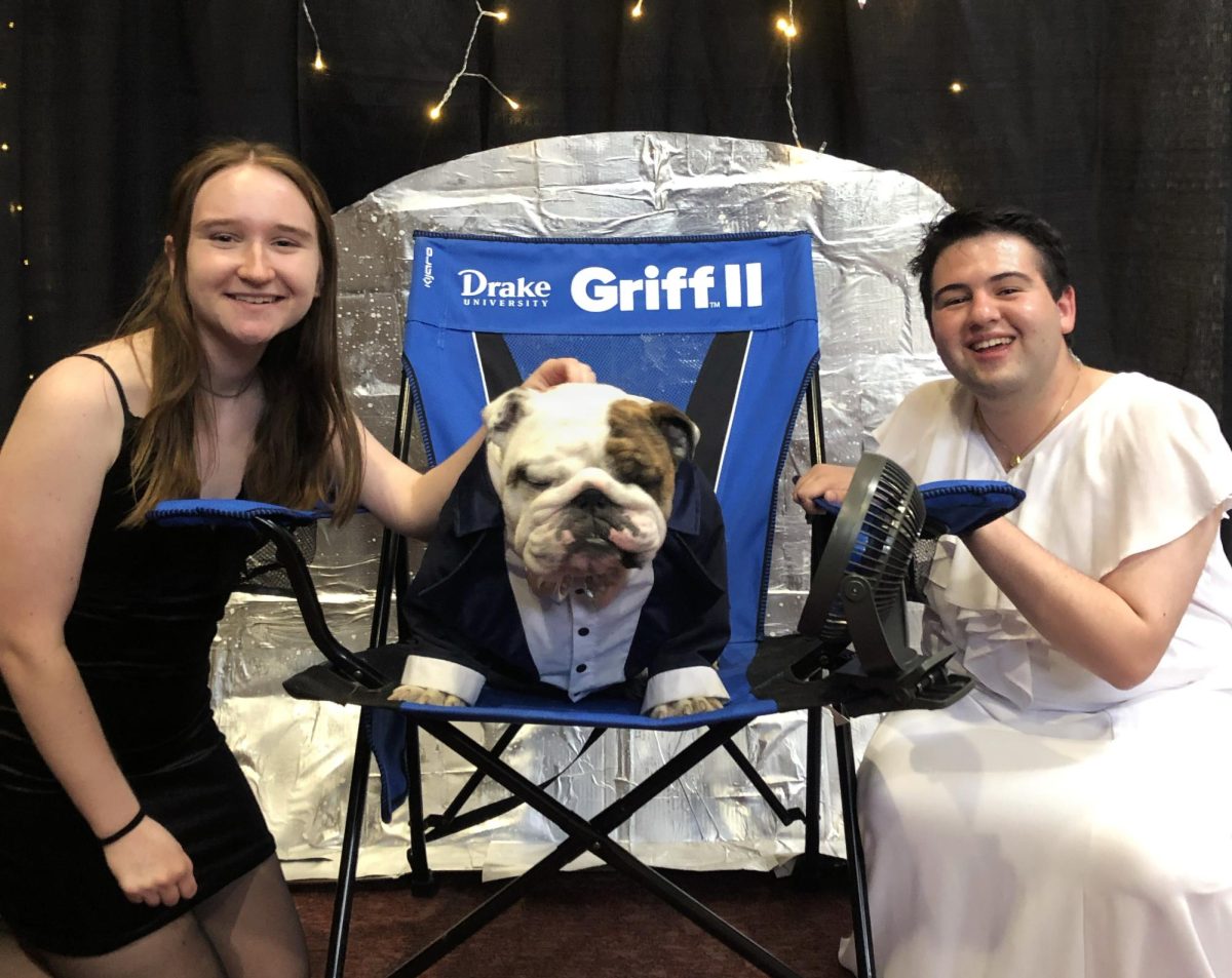 Current DUiN president Natalie Onkst (right) poses with Griff and a friend at a previous DUiN ball. One of Onkst’s favorite DUiN memories is spending the entirety of one DUiN ball in the ball pit. Photo courtesy of Natalie Onkst 