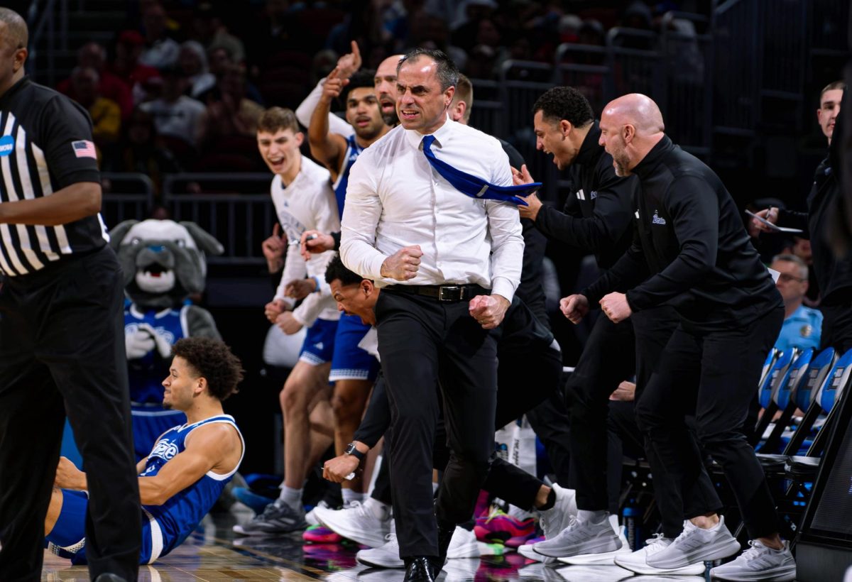Former men’s basketball head coach Ben McCollum celebrates a Drake move at a game last season. McCollum transferred to Iowa City to coach the Hawkeyes and brought much of the Drake roster with him. Photo courtesy of Drake Athletics