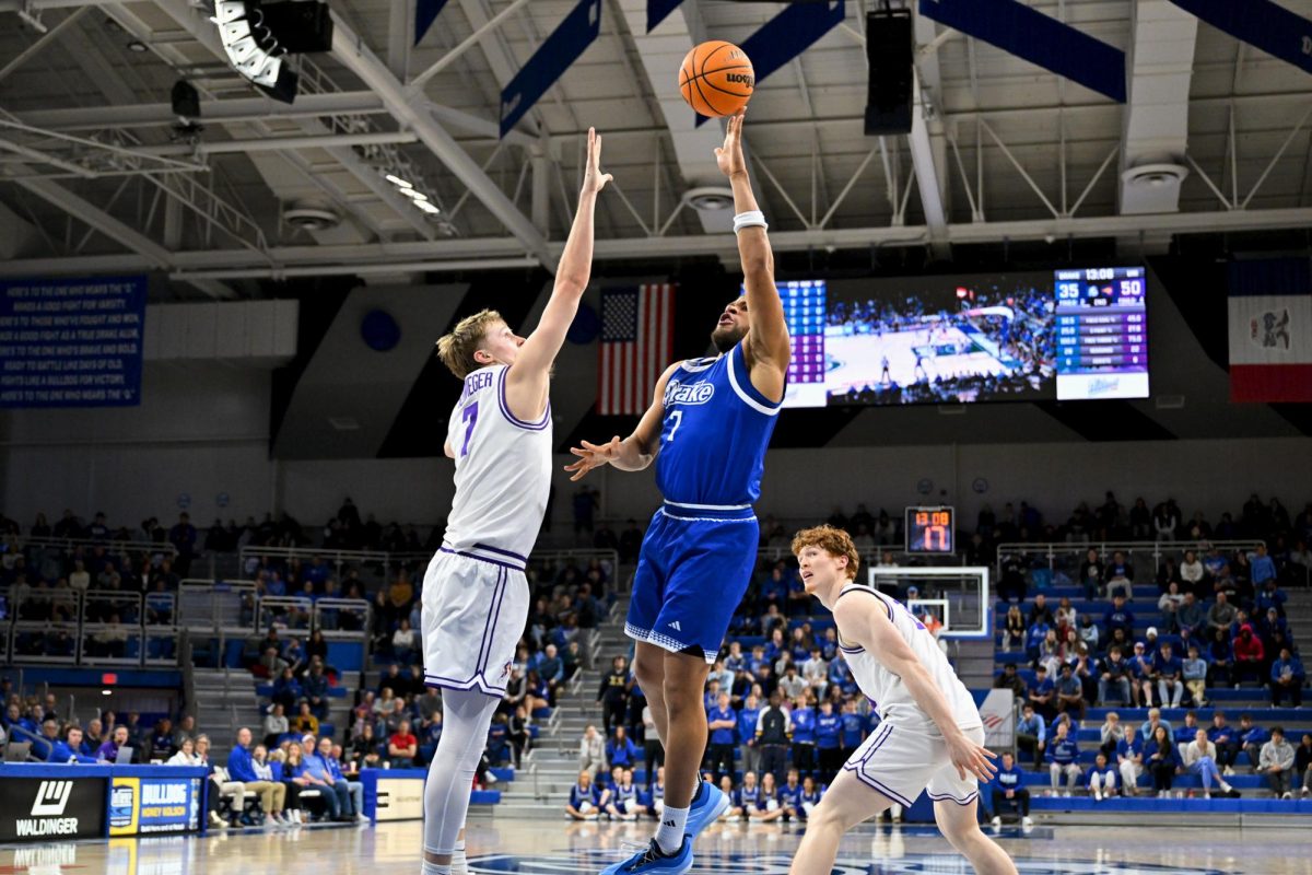 Forward Wilguens Jr. Exacte reaches for the ball in the second half of the March 1 game against the University of Northern Iowa. The Bulldogs lost the game 75-53 and placed ninth in the Missouri Valley Conference rankings going into the Arch Madness tournament.  Photo courtesy of Luke Lu 