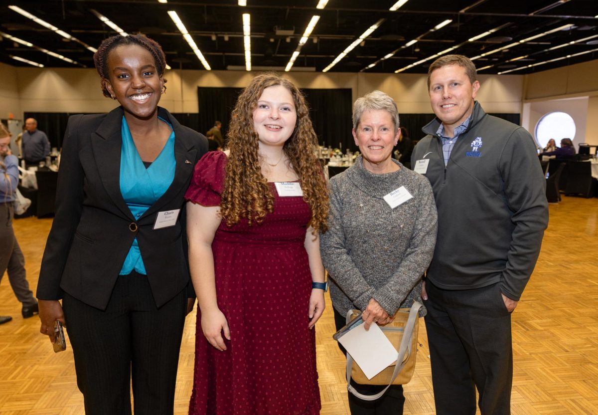 Zimpleman scholar Maddie Kellogg poses with Drake alumni at the 2026 Alumni Student Networking Breakfast on Feb. 26. The event is one of many that aim to keep alumni engaged with the Drake campus.  Photo courtesy of Drake Alumni Relations.